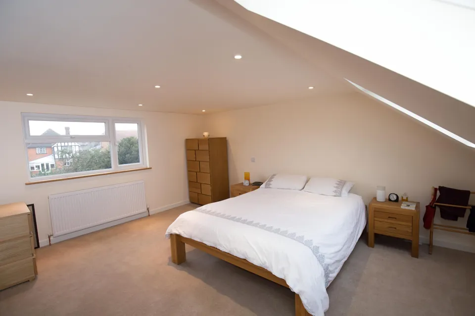 Loft bedroom with oak furniture