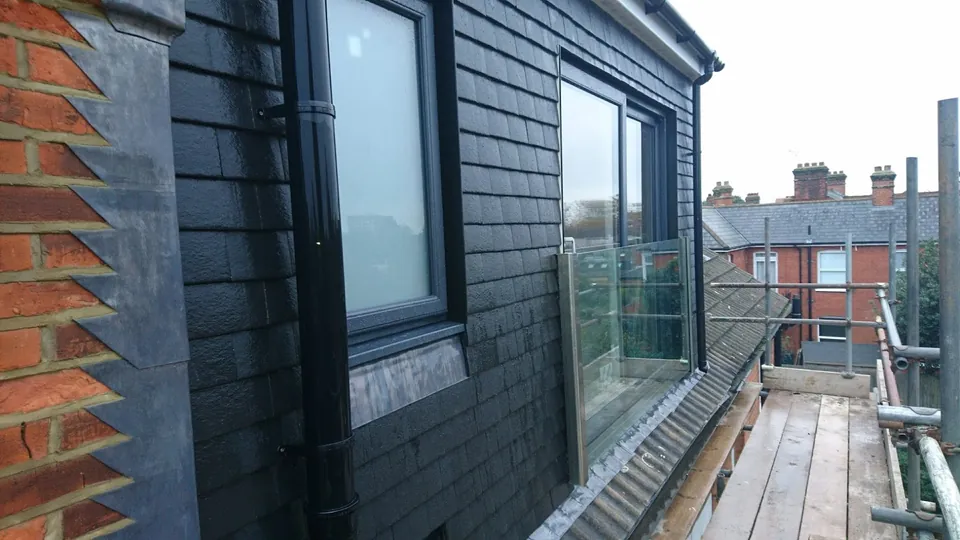 Black dormer with glass balustrade
