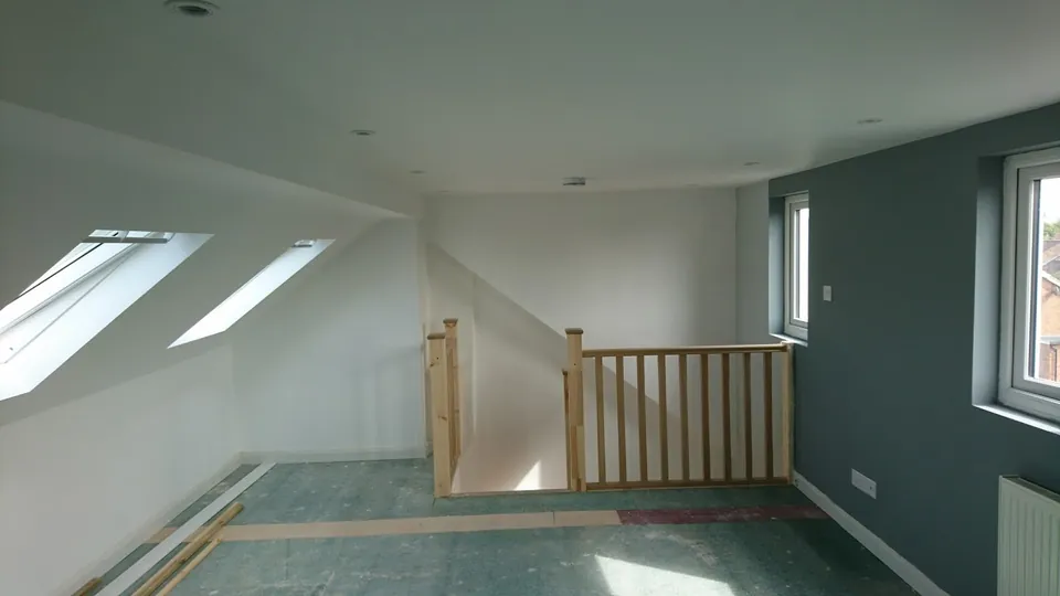 Loft landing with roof windows and oak balustrade