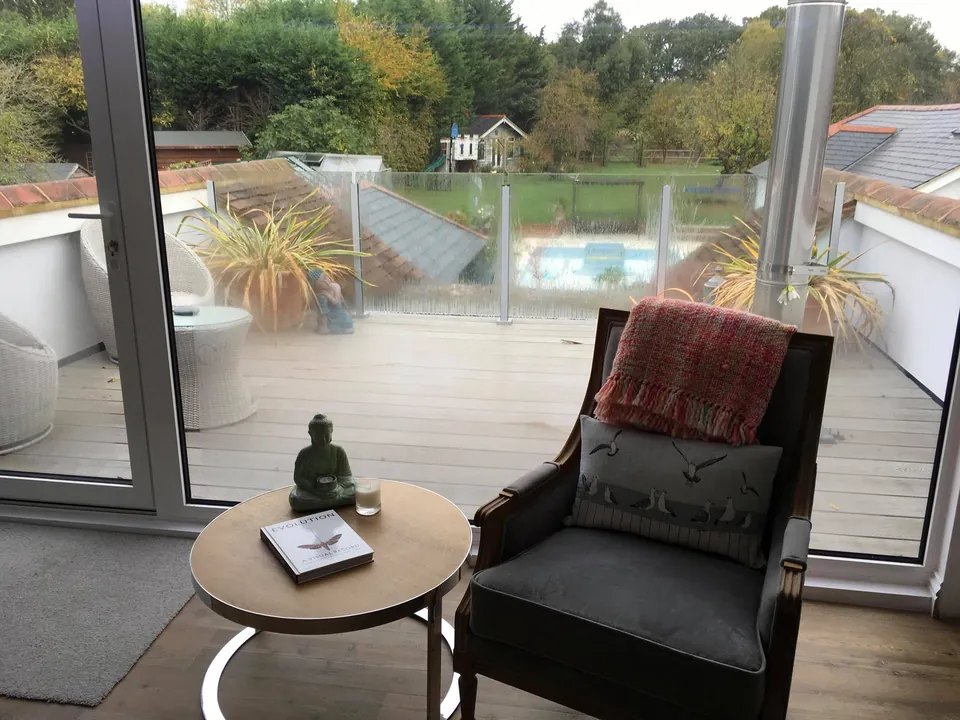 Armchair beside glazed doors in a loft suite