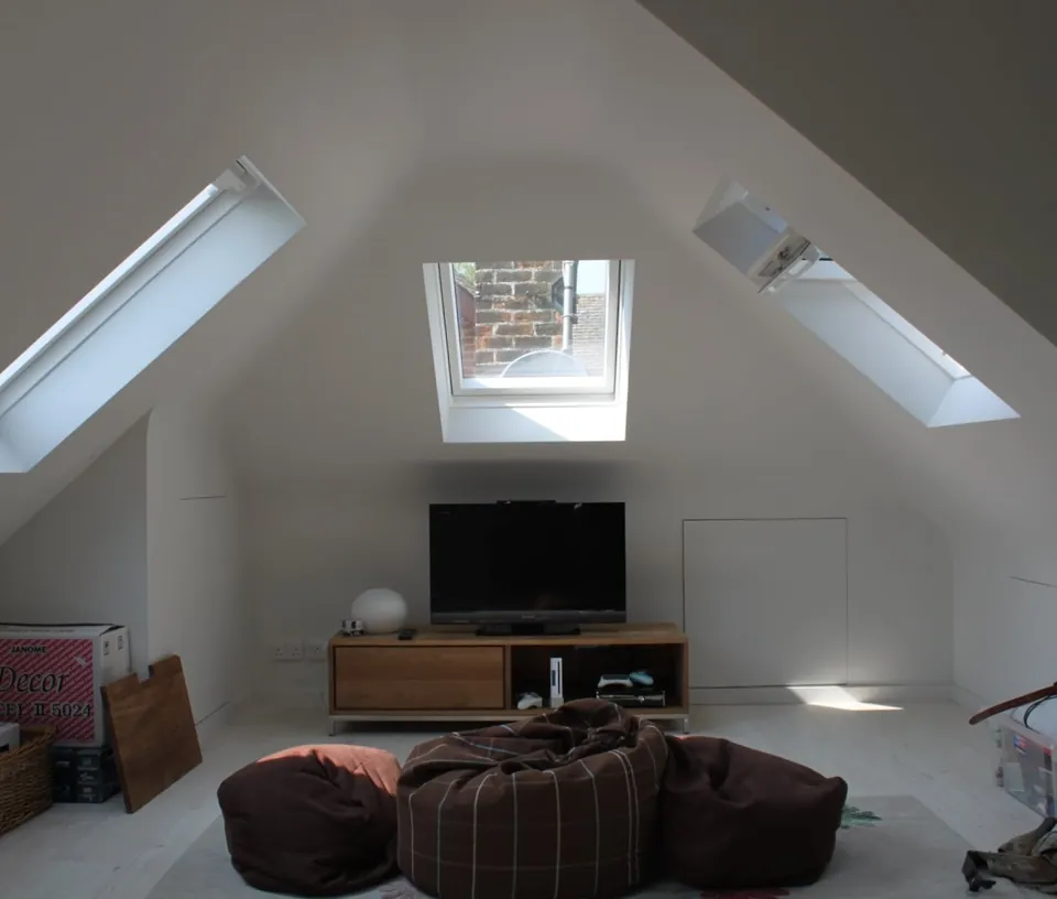Finished loft room lit by three Velux roof windows